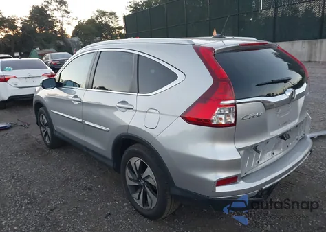2015 Honda Cr-V Touring z USA, uszkodzony, nr VIN 5J6RM4H95FL109626